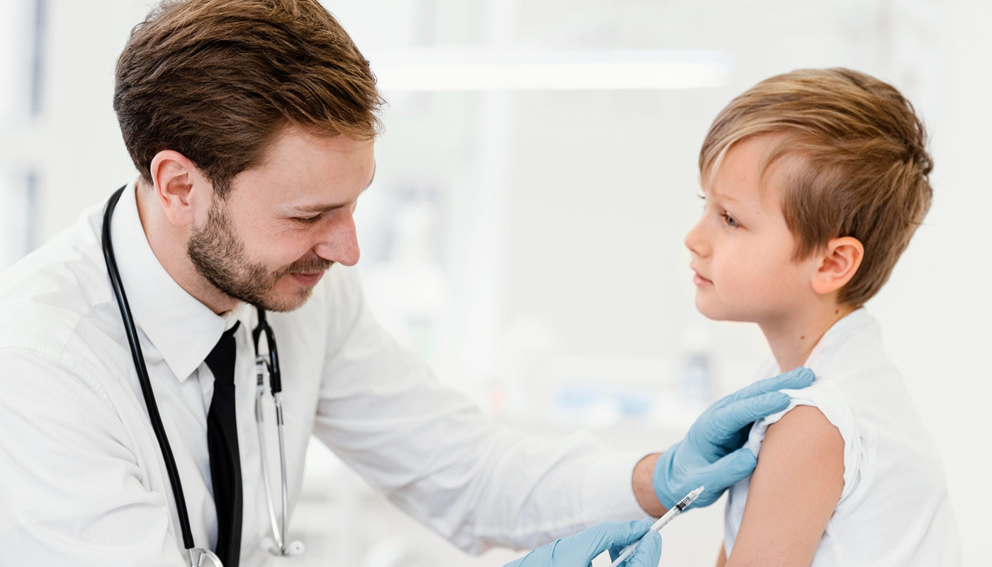 A doctor is examining a young girl 's shoulder.