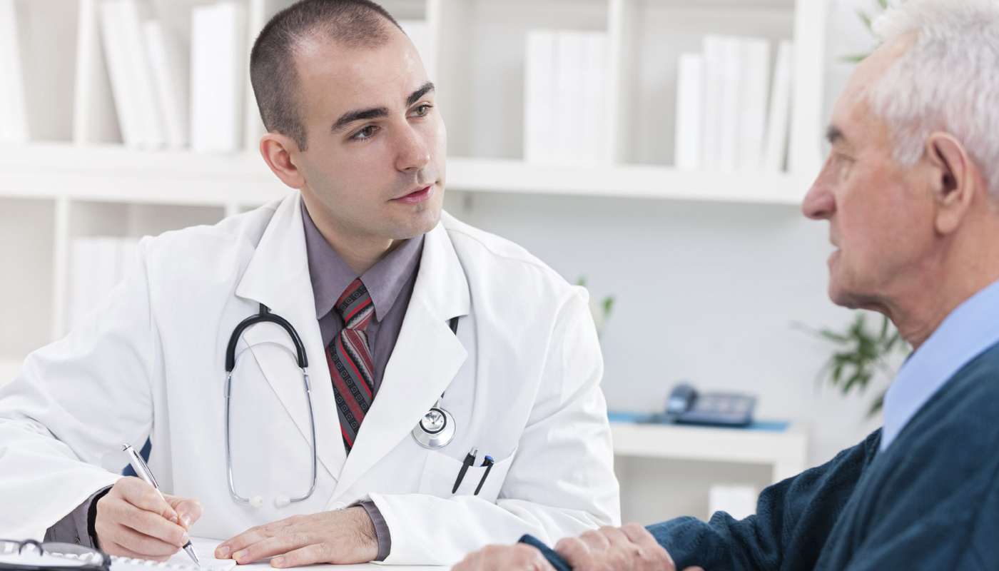 A doctor is sitting in front of another doctor.