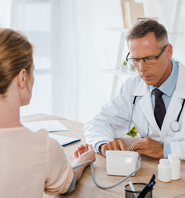 A doctor is talking to a woman about her blood pressure.